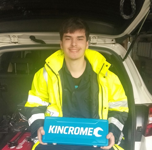 Adam Duncan holding a blue box labeled KinCrome